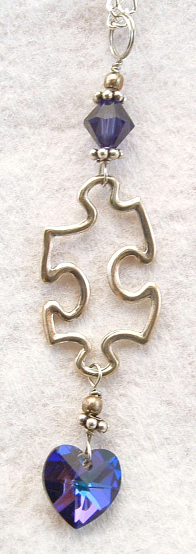 Solid silver puzzle piece pendant with Swarovski crystals